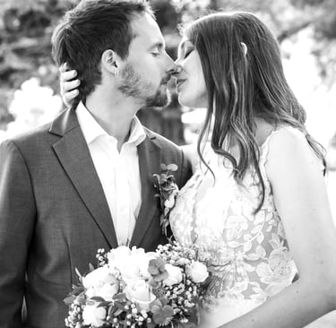 a man and woman kissing in a wedding photo