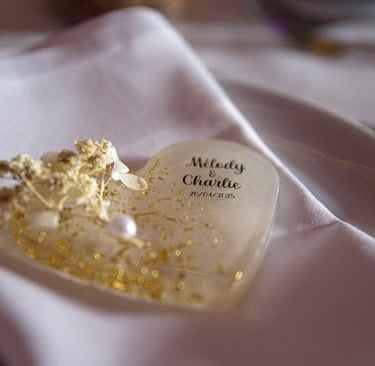 a heart shaped cake with a gold leaf decoration