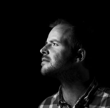 a man with a beard and a plaid shirt