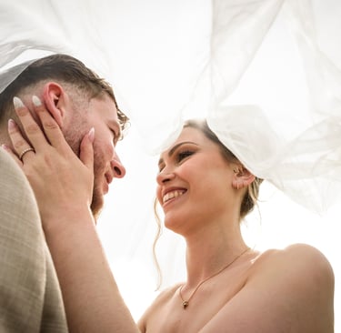 a bride and groom are smiling and laughing