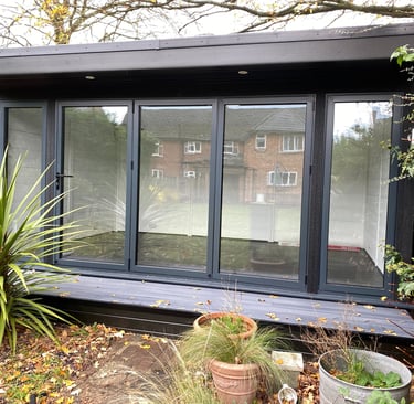 Garden room with aluminium bi-folding doors