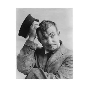 a man in a suit and hat with a hat on