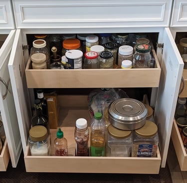 Pull out shelving in a kitchen cabinet for maximum convenience.