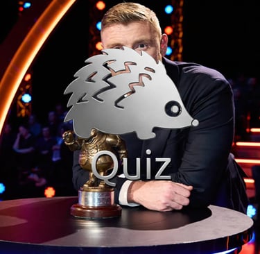 a man in a suit and tie is holding a trophy