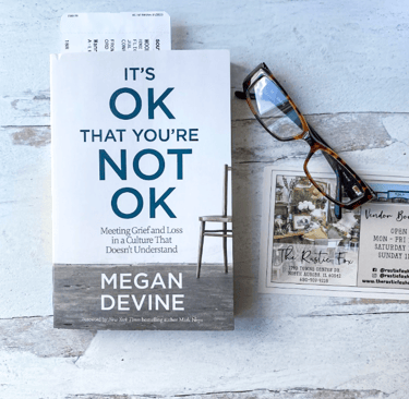 Grief Book on Desk with Reading Glasses