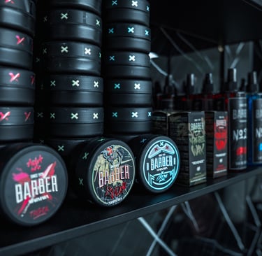 a shelf of barber products and other items