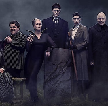 Full cast portrait for Wednesday Season 2, featuring Jenna Ortega, Catherine Zeta-Jones, Luis Guzmán