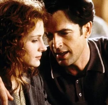 Julia Roberts and Dermot Mulroney in a close moment from My Best Friend’s Wedding (1997), portraying
