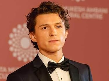 Tom Holland in a tuxedo on the red carpet, sparking speculation about his possible future as James B