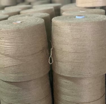 Stacks of premium-grade jute yarn, crafted with precision and sustainability in mind. Perfect for ec