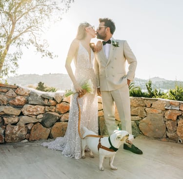 Newlywed couple kissing at a coastal wedding at Bodrum. Teo Events Management production Agency 