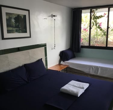 King bed in Callachuchi Homestay bungalow