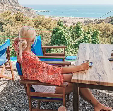 girl sits in tavern with the view
