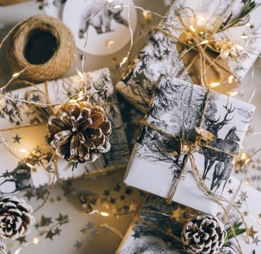 gift boxes wih white paper and lights