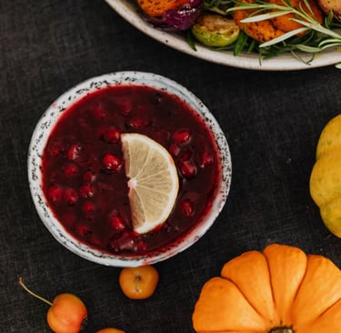 cranberry sauce with some fruits on the table