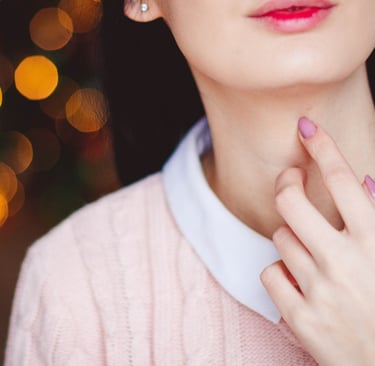 girls hand on her neck