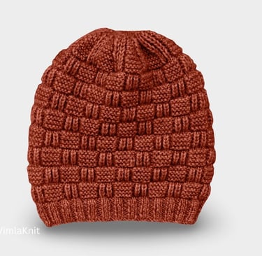 Brown hand-knitted beanie with checkerboard stitch pattern on a light background.