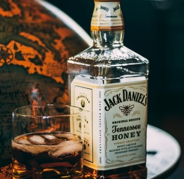 Bottle of Jack Daniels and a glass of whiskey on ice