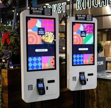 two self service touchpoints in a Cafe
