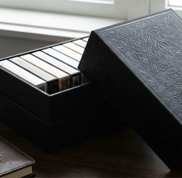 Custom rigid brick box packaging for 12 decks of playing cards.