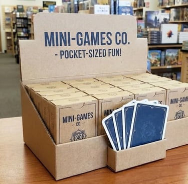 Retail display stand filled with custom indie micro card games.