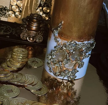 coins and a gold candle