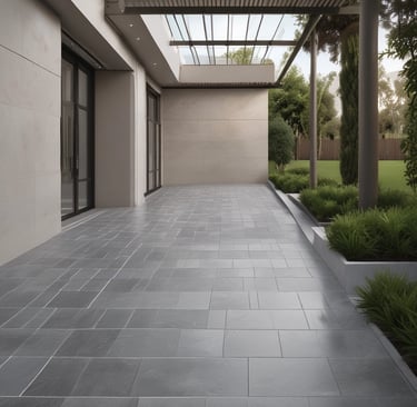 A close-up view of a marble surface showcasing intricate patterns and veins in shades of gray and white. The natural swirls and textures create a dramatic and elegant appearance.