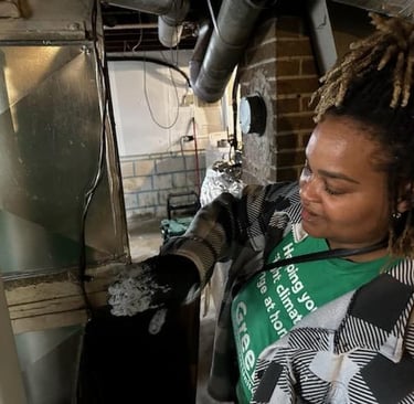 Worker sealing HVAC ducts to save energy
