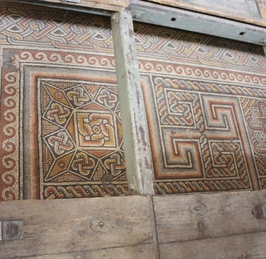 Mosaic floor protected by glass walkway in the Church of the Nativity