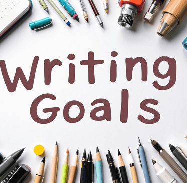 a bunch of pens and pens on a white paper surrounding the words Writing Goals
