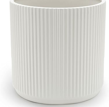 a white ceramic vase with a white ribbed