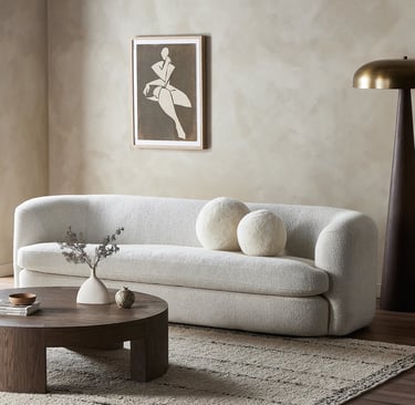 a living room with a couch and a table