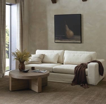 a living room with a couch and a table