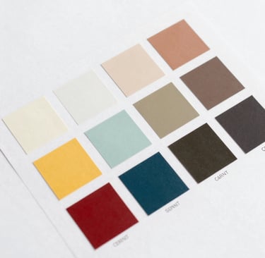 A collection of labels arranged in a fanned-out pattern, each featuring illustrations of a red factory with a green chimney and a yellow area with text and barcodes. The labels are neatly organized on a white background.