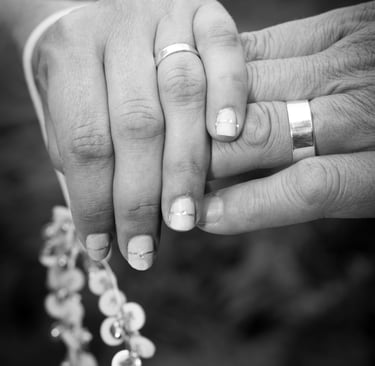 newly weds holding hands in black and white