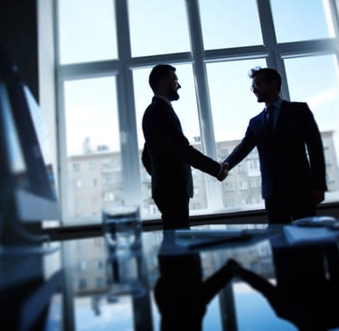 Two people shaking hands, agreeing to a fulldome distribution deal.