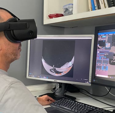 Person wearing a VR headset using Festoon software to view inside a virtual dome.