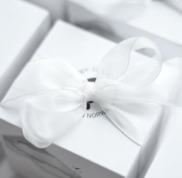 a white box with a bow tie on it