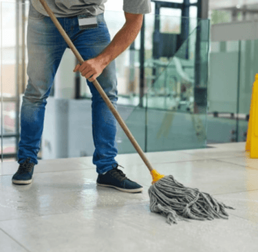 man mopping floor