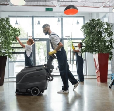 Man using floor scrubbing machine