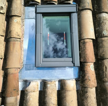 fenetre de toit avec abergement soudure en  zinc 