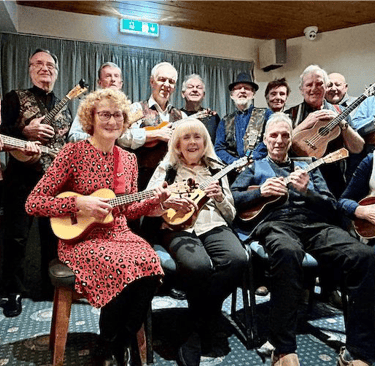 Banjo ukulele band supporting the SCMGS charity music Beatles pop entertainment