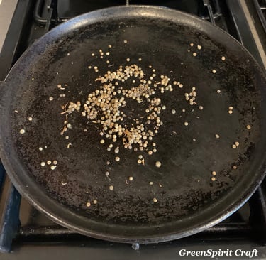 Cleavers seeds on a small cast iron skillet