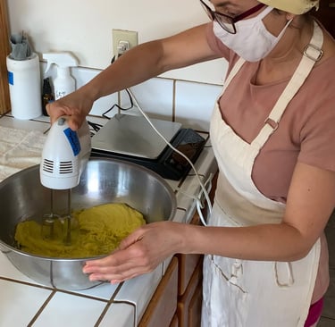 Katrina Matos whipping a bowl of face & body butter