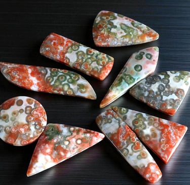 red ocean jasper cabochons rare collectors material with red and green orbs