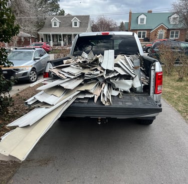 Aluminum siding loaded in truck bed for recycling 
