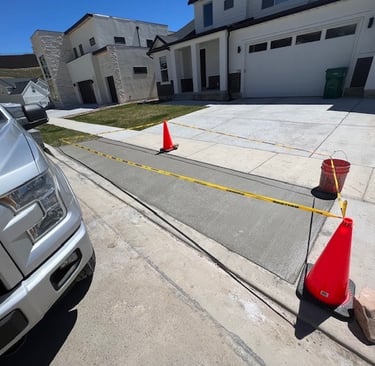 a truck parked in front of a house with a red cone