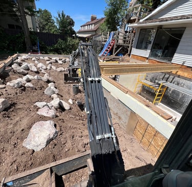 Excavator building a retaining wall