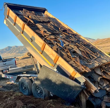 Roofing materials haul away and disposal in a dump trailer 