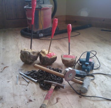 Custom tools for distressing oak to achieve a rustic look.